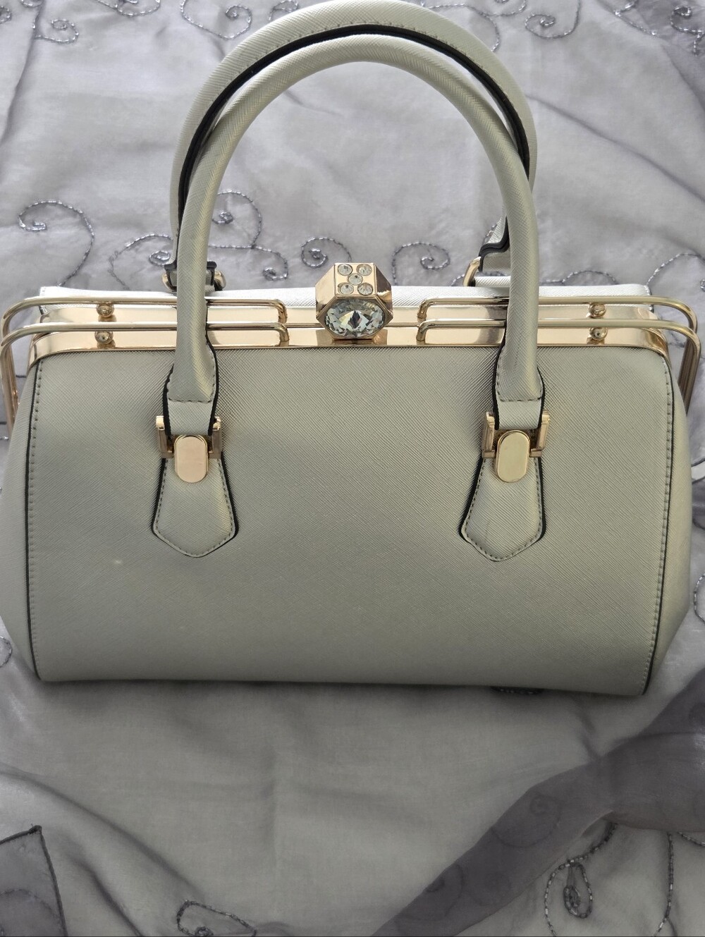 Crystal Clasp Silver Satchel.